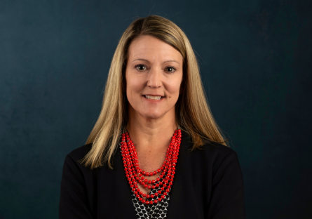 Dr. Heather Kruse headshot on grey background