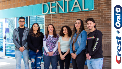 PC Dental Hygiene scholarship recipients with their faculty member standing outside dental building