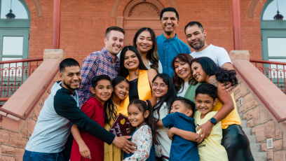 Phoenix College alumna Sandra Quiroz embraced by her boyfriend and her family at her ASU graduation. 