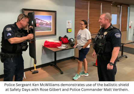 Phoenix College Police Sergeant Ken McWilliams demonstrates use of the ballistic shield to Rose Gilbert and Police Commander Matt Verthein at Safety Days, one of the Fall 2023 Learning Sessions