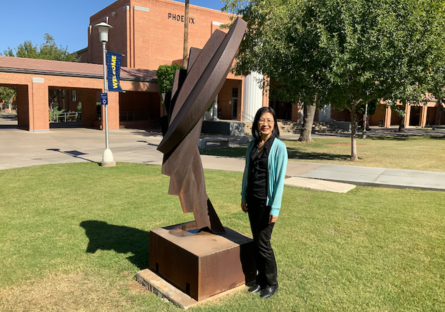 Ayumi Sasaki stands in the courtyard outside the Phoenix College Library where she attends English Conversation Circles after her English as a Second Language (ESL) class. 