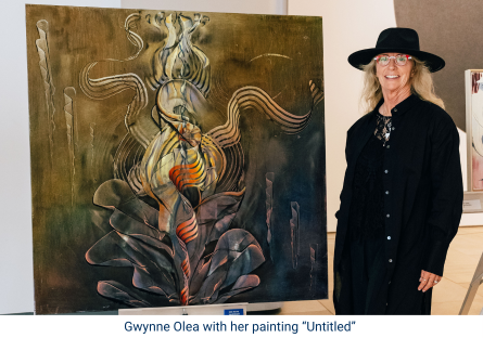 Phoenix College student Gwynne Olea stands next to her paining "Untitled" during the Eric Fischl Series at the Phoenix Art Museum