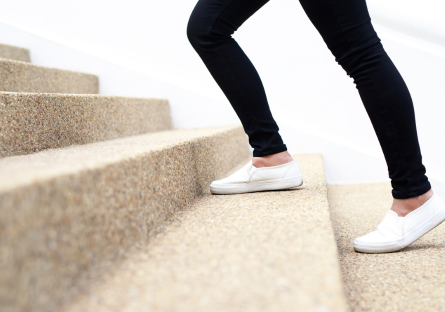 woman walking up steps