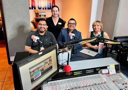 Alfredo H., Paula C. and Ramon C. with Maria Teresa Bonilla sitting in the radio recording studio