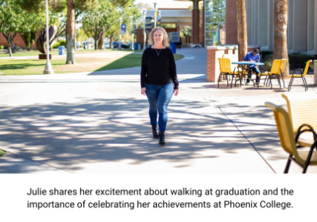 PC student Julie Augustine walking on campus with the college library behind her.