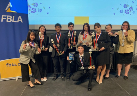 Phoenix College Future Business Leaders of America students with their competition medals and trophies.