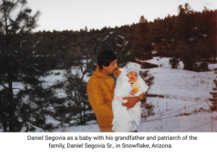Phoenix College alum and staff member Daniel Segovia as a baby held by his grandfather Daniel Segovia Sr. in Snowflake, Arizona. 