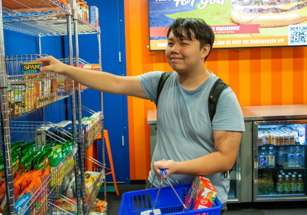 A Phoenix College student chooses items from the Bumstead Resource Room in the Student Union