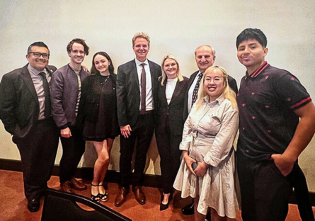 Peter Banko poses with Phoenix College faculty, staff and students at Heroes of Education event