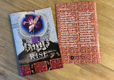 copy of RISE on a table with the front and back cover being shown