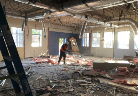 Ongoing Renovation and Restoration - Crew Worker inside building