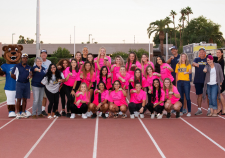 PC Womens Softball Team holding up rings including Bumstead