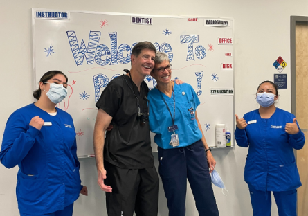Dr. Greg Patterson and PC Faculty Rita Perry with dental students