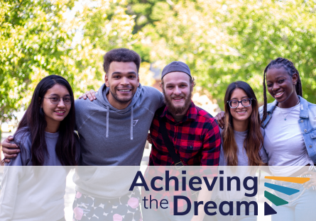 Photo of five PC students arm in arm with the overlay of the "Achieving the Dream" logo