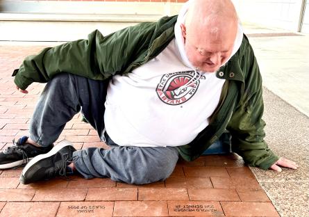 Harold visits Phoenix College's Heritage Plaza to pay tribute to his mother's memory at the legacy brick bearing her name.
