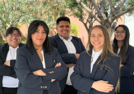 PC United Executive Board (5 students in navy blazers standing outside)