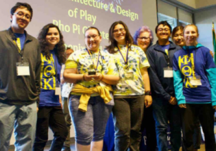 PC’s Rho Pi Chapter students holding their award