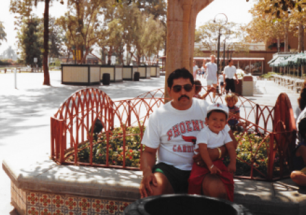 Daniel Segovia as a baby held by his grandfather Daniel Segovia Sr. 