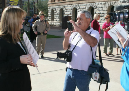 José Muñoz taking photos during a political event at the Phoenix Capital